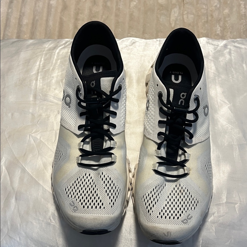 On Running White and Black Athletic Shoes